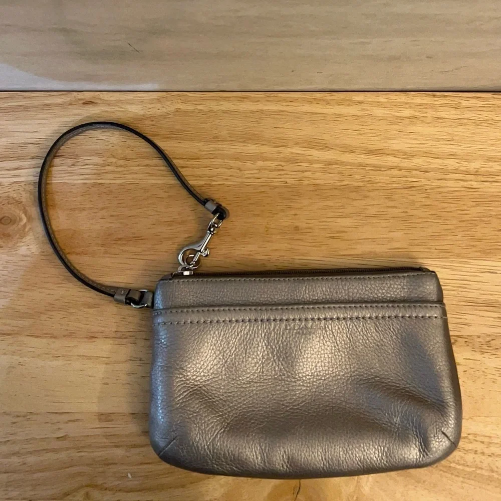 Coach metallic leather wristlet clutch purse.